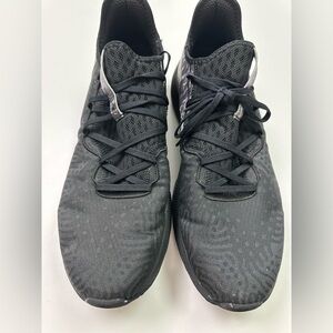 New Balance Fuelcell V100 Black Sneakers with camo accents.